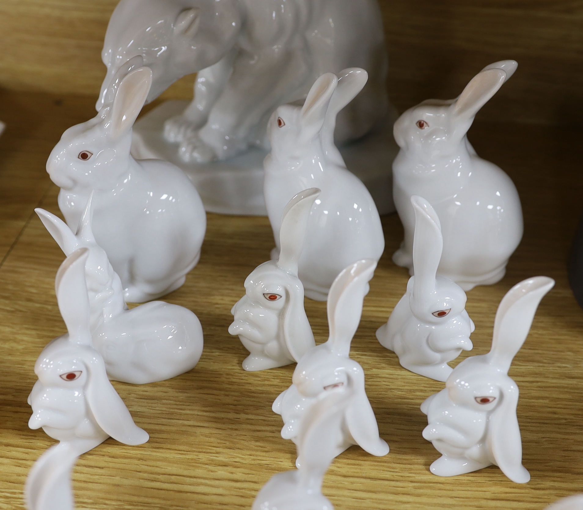 An Herend Polar bear and three sets of four graduated white glazed rabbits and a single green glazed rabbit, all by Herend Polar bear, 20cm high (14)